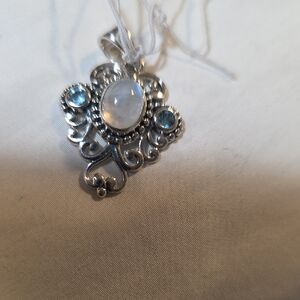 Elegant Sterling Silver Pendant with Blue Topaz And Rainbow Moonstone Accents
